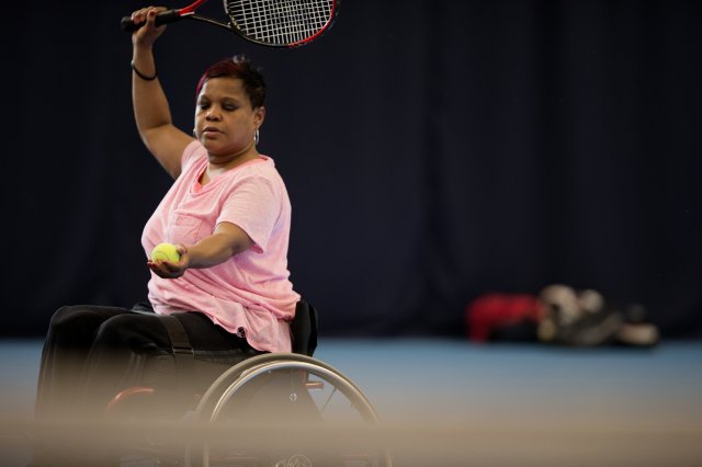 Lady playing Wheelchair Tennis